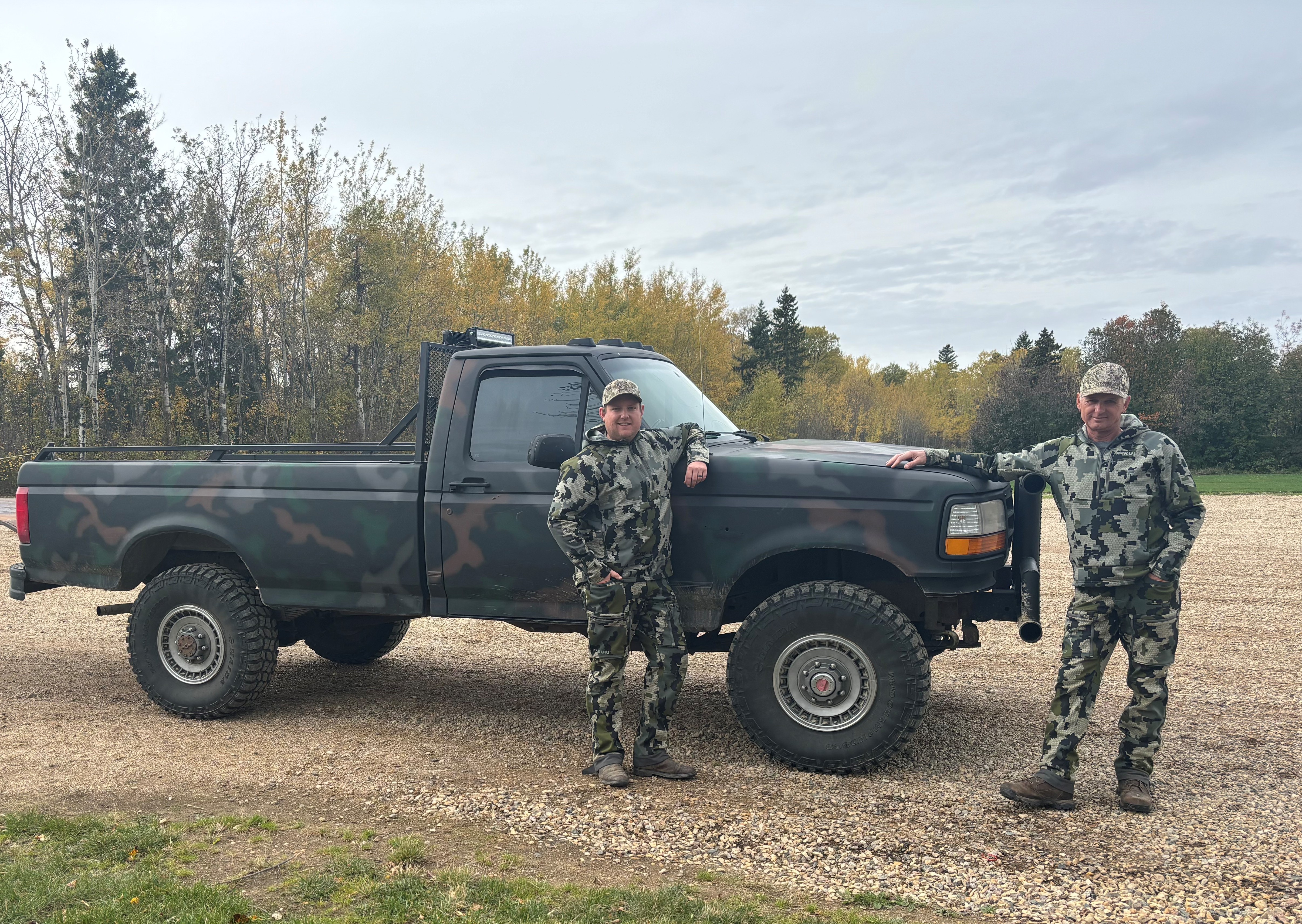 Guide and hunter in the field at Echo Lake Hunts in Saskatchewan
