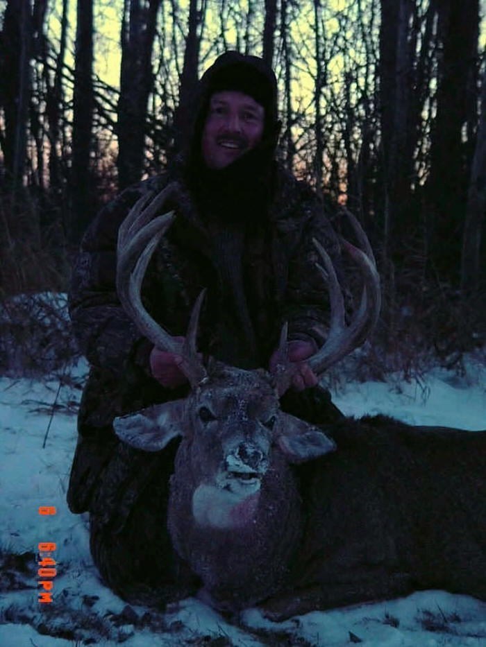 George Tunal with trophy whitetail at Echo Lake Hunts in Saskatchewan