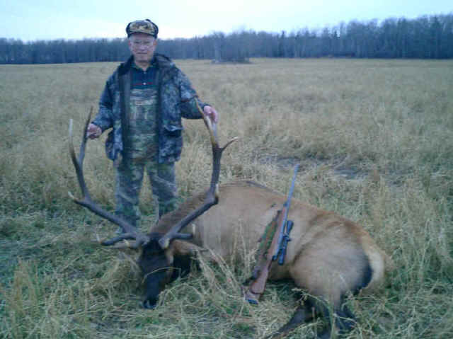 Bill Perry from Texas with trophy bull elk at Echo Lake Hunts in Saskatchewan