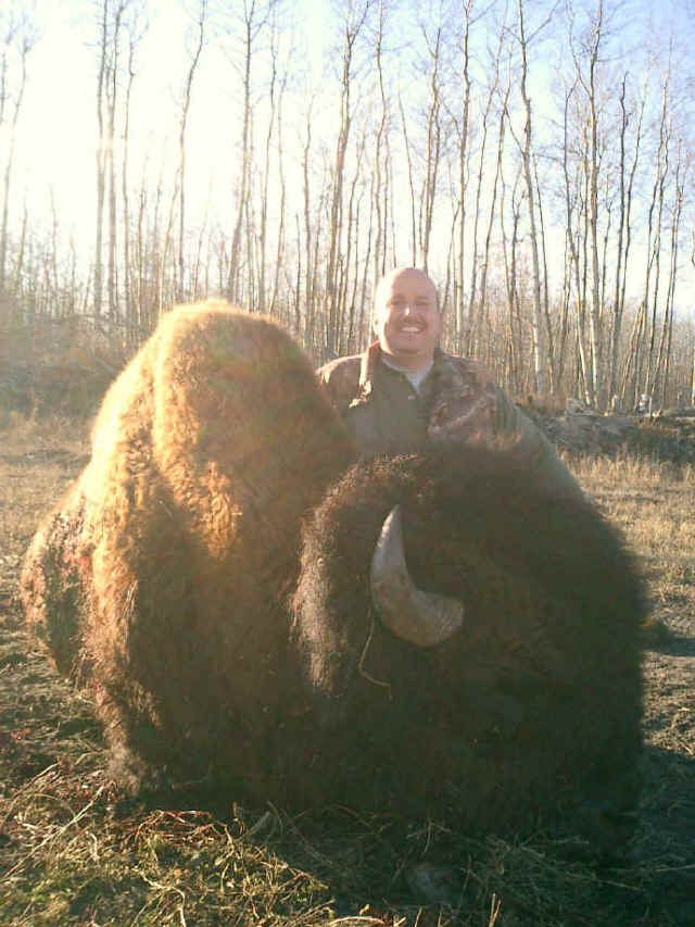 George Tunal from Texas with trophy bison at Echo Lake Hunts in Saskatchewan
