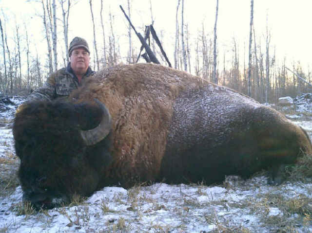 Greg Cromer from Texas with trophy bison at Echo Lake Hunts in Saskatchewan