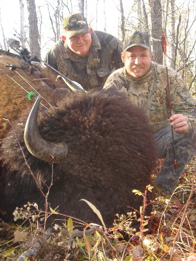 Ronnie Jr. and Ronnie Sr. with a massive bison