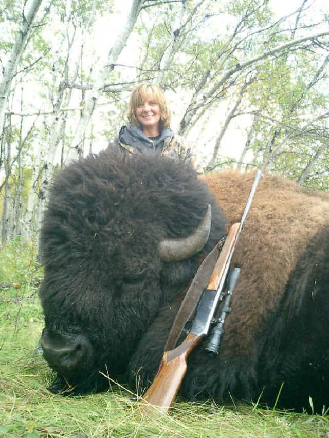 Dianna Herrin from Arizona with trophy bison at Echo Lake Hunts in Saskatchewan