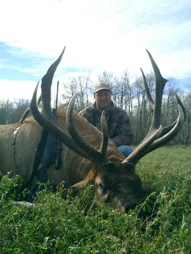 Ernesto Villalobos from Mexico with trophy elk at Echo Lake Hunts in Saskatchewan