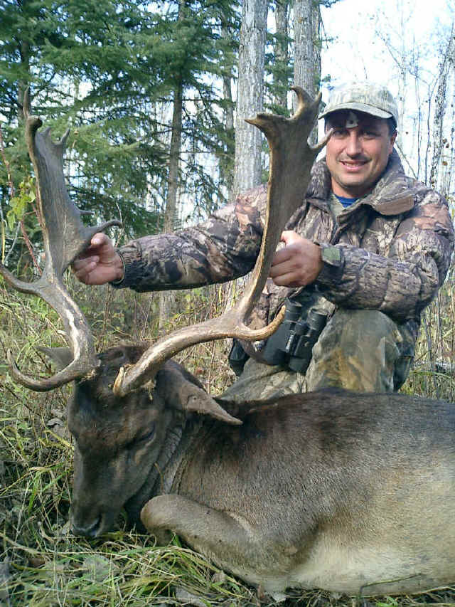 Ernesto Villalobos from Mexico with trophy reindeer at Echo Lake Hunts in Saskatchewan