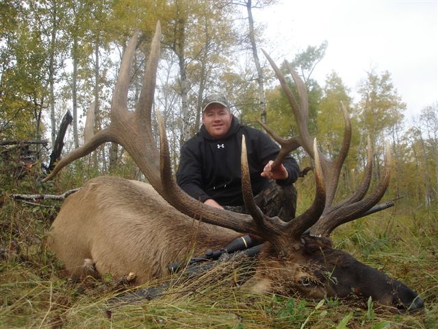 Bryce Rowley from Utah with trophy bull elk at Echo Lake Hunts in Saskatchewan