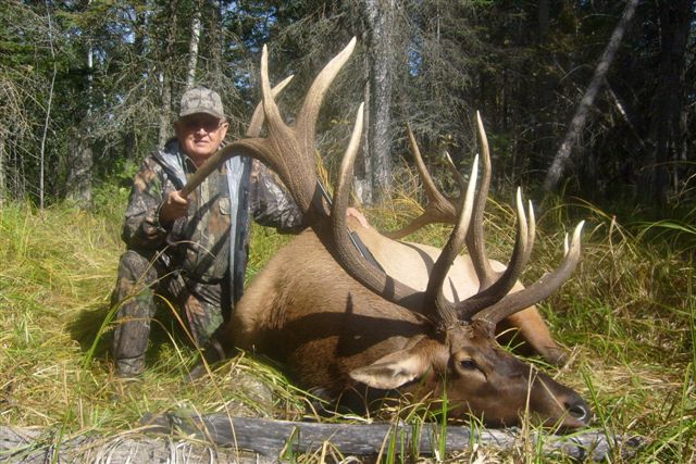 Charles Butler from New Mexico with trophy bull elk at Echo Lake Hunts in Saskatchewan