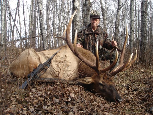 Julio Gomez Sr from Mexico with trophy bull elk at Echo Lake Hunts in Saskatchewan