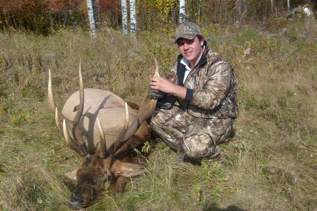 Ramiro Vertiz Jr from Mexico with trophy bull elk at Echo Lake Hunts in Saskatchewan