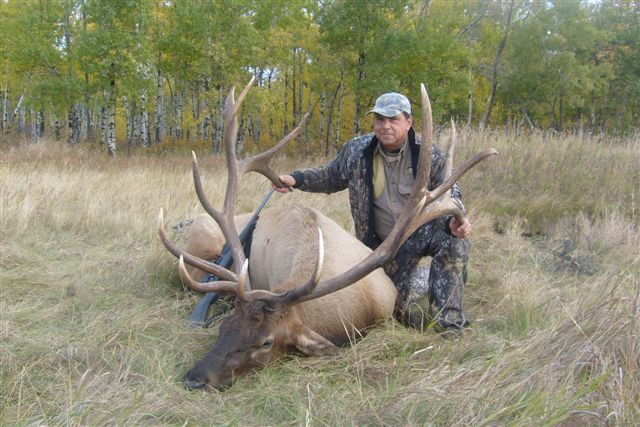 Ramiro Vertiz Sr from Mexico with trophy bull elk at Echo Lake Hunts in Saskatchewan