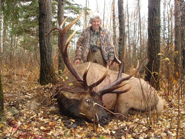 Sally McCoy from Ohio with trophy bull elk at Echo Lake Hunts in Saskatchewan