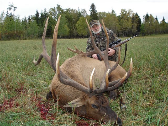 Tom Bray from Indiana with trophy bull elk at Echo Lake Hunts in Saskatchewan