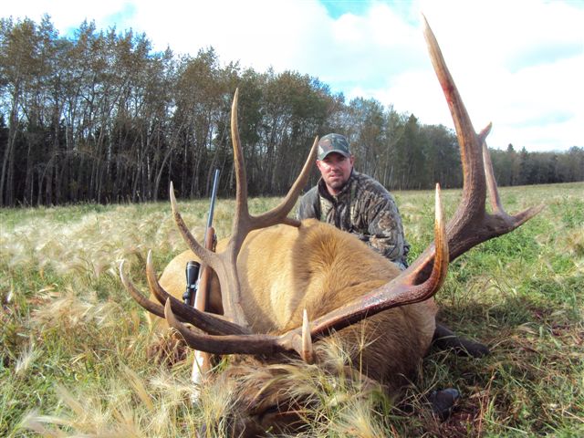 Philip Johnson from Florida with trophy bull elk at Echo Lake Hunts in Saskatchewan
