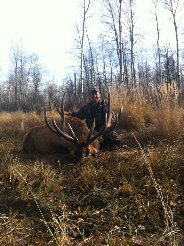 Eric Hoover from Texas with trophy bull elk at Echo Lake Hunts in Saskatchewan