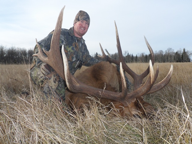 Josh Hall from Oklahoma with trophy bull elk at Echo Lake Hunts in Saskatchewan