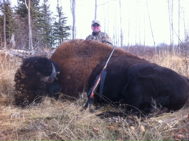 Mitchell Brown from Oklahoma with trophy bison at Echo Lake Hunts in Saskatchewan