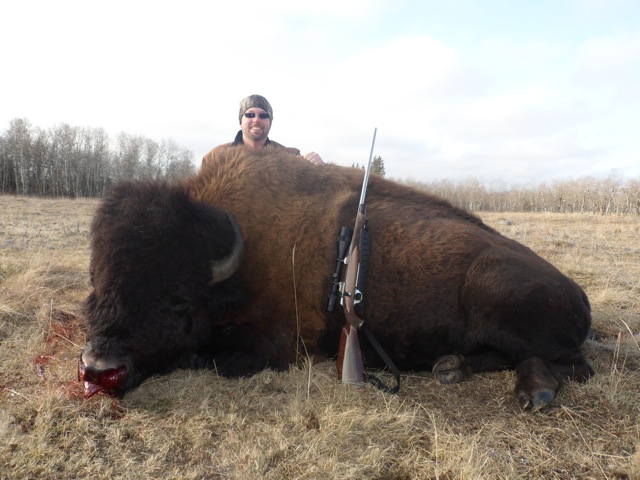 Russell Rankin from Oklahoma with trophy bison at Echo Lake Hunts in Saskatchewan