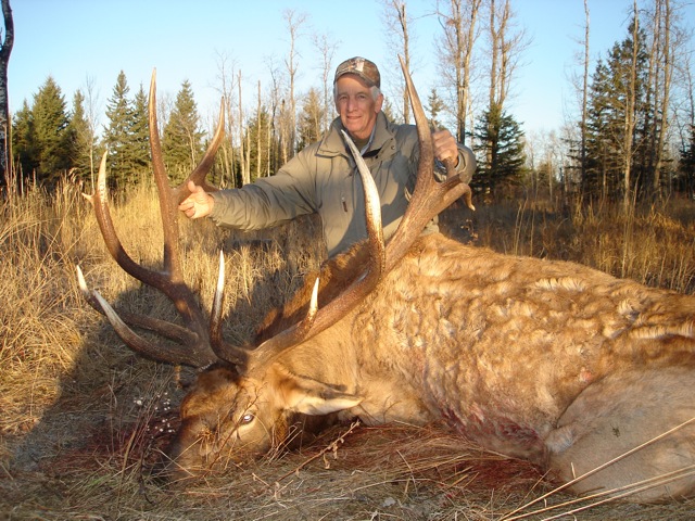 Tommy Rotello Sr from Texas with trophy bull elk at Echo Lake Hunts in Saskatchewan