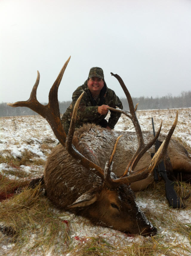 Scott Cook from Georgia with trophy bull elk at Echo Lake Hunts in Saskatchewan