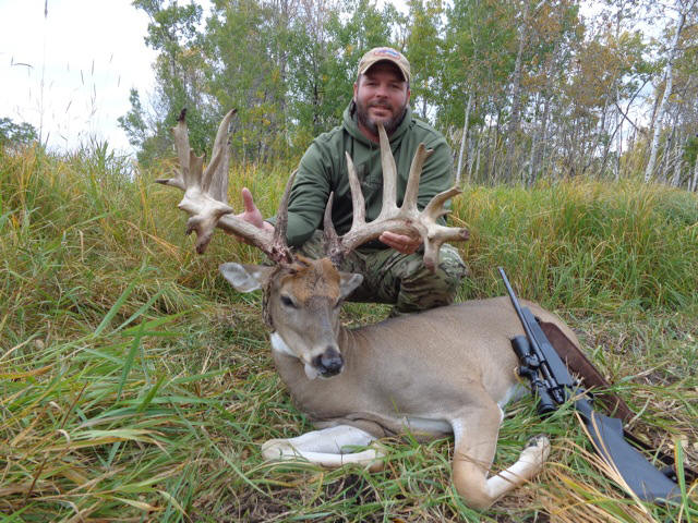 Brian Foster from Texas with trophy bull elk at Echo Lake Hunts in Saskatchewan