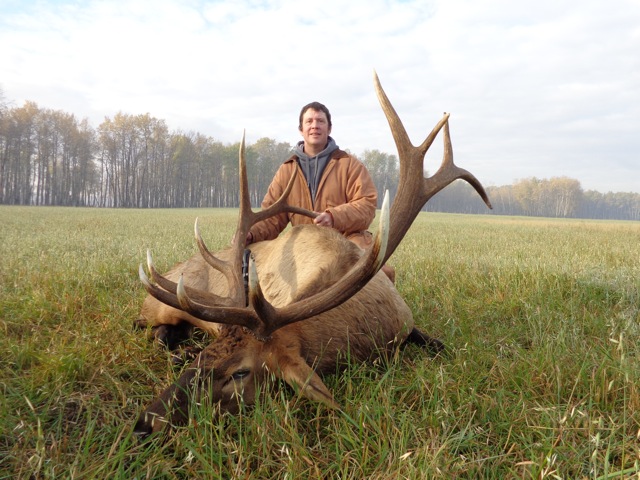 Rick Honnold from Washington with trophy bull elk at Echo Lake Hunts in Saskatchewan