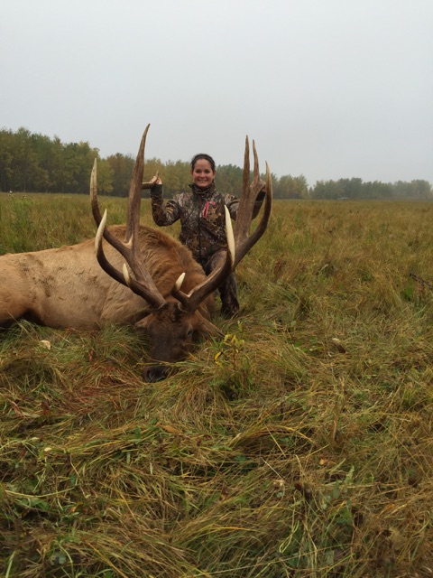 Tiffany Cooper from Texas with trophy bull elk at Echo Lake Hunts in Saskatchewan