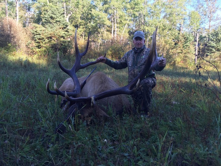 Jim Burau from North Dakota with trophy bull elk at Echo Lake Hunts in Saskatchewan