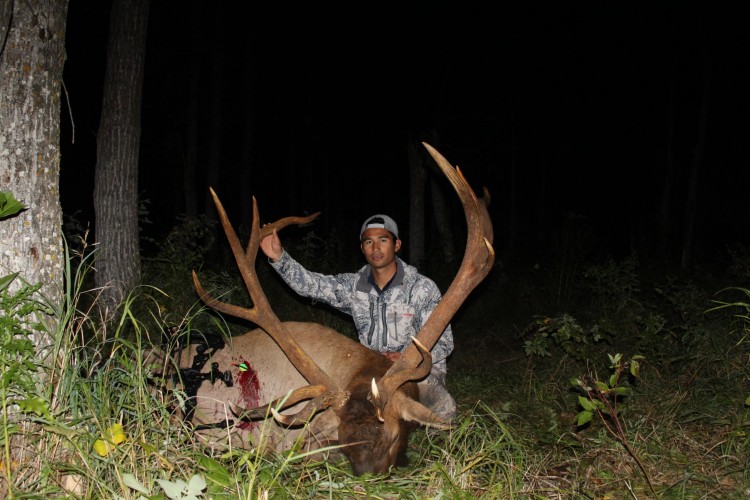 Kama Chow from Hawaii with trophy bull elk at Echo Lake Hunts in Saskatchewan