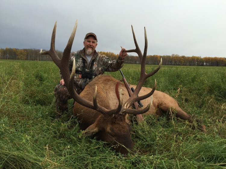 Terry Cochran from Wisconsin with trophy bull elk at Echo Lake Hunts in Saskatchewan