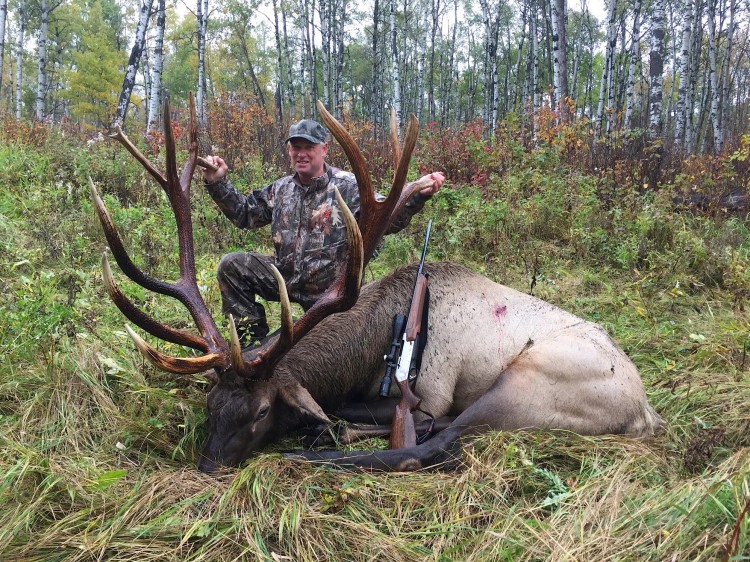 Wayne Smith from Canada with trophy bull elk at Echo Lake Hunts in Saskatchewan