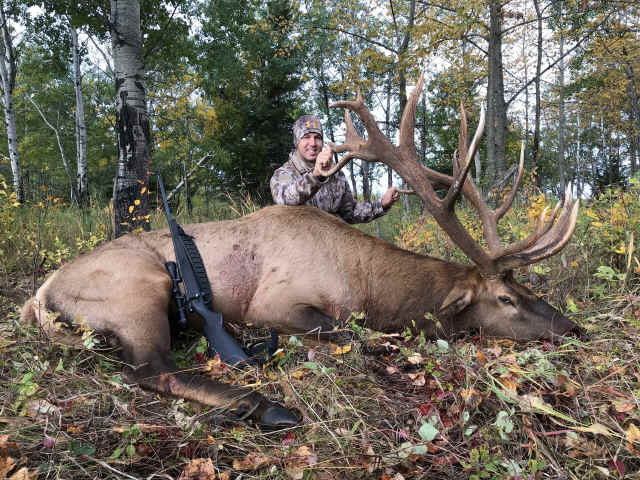 Kevin Barretine from Texas with trophy bull elk at Echo Lake Hunts in Saskatchewan