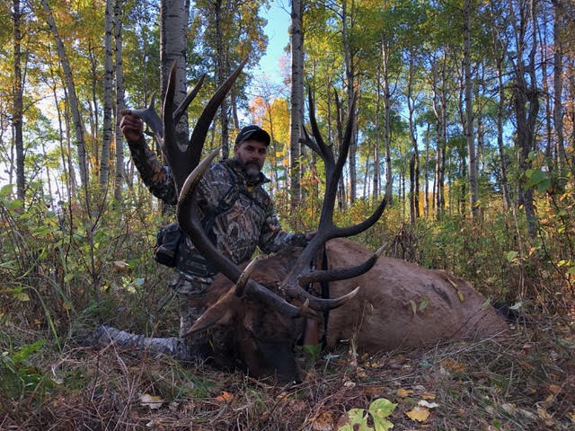 Terry Ball from North Dakota with trophy bull elk at Echo Lake Hunts in Saskatchewan