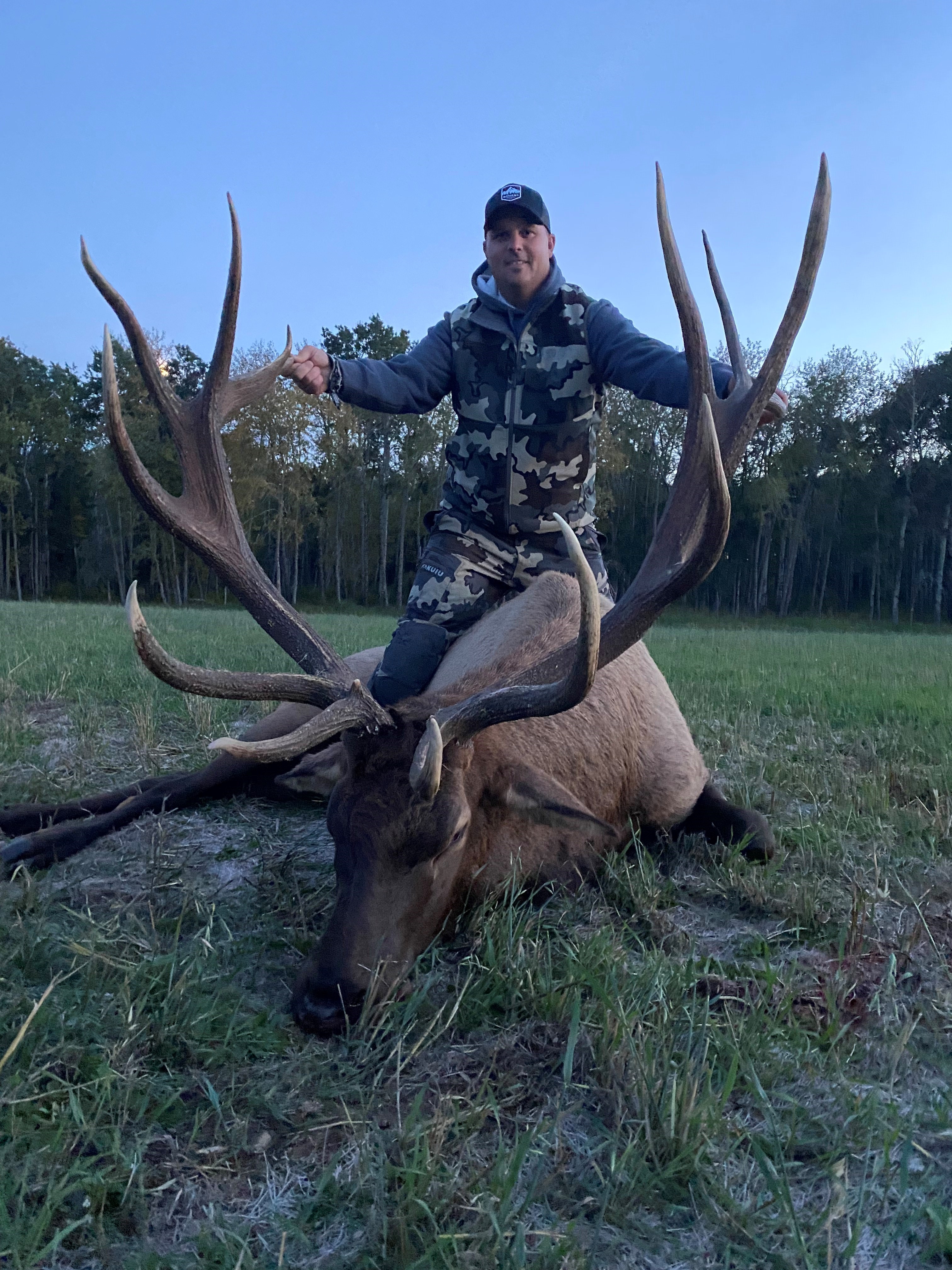 Issac Smith from North Dakota with trophy bull elk at Echo Lake Hunts in Saskatchewan