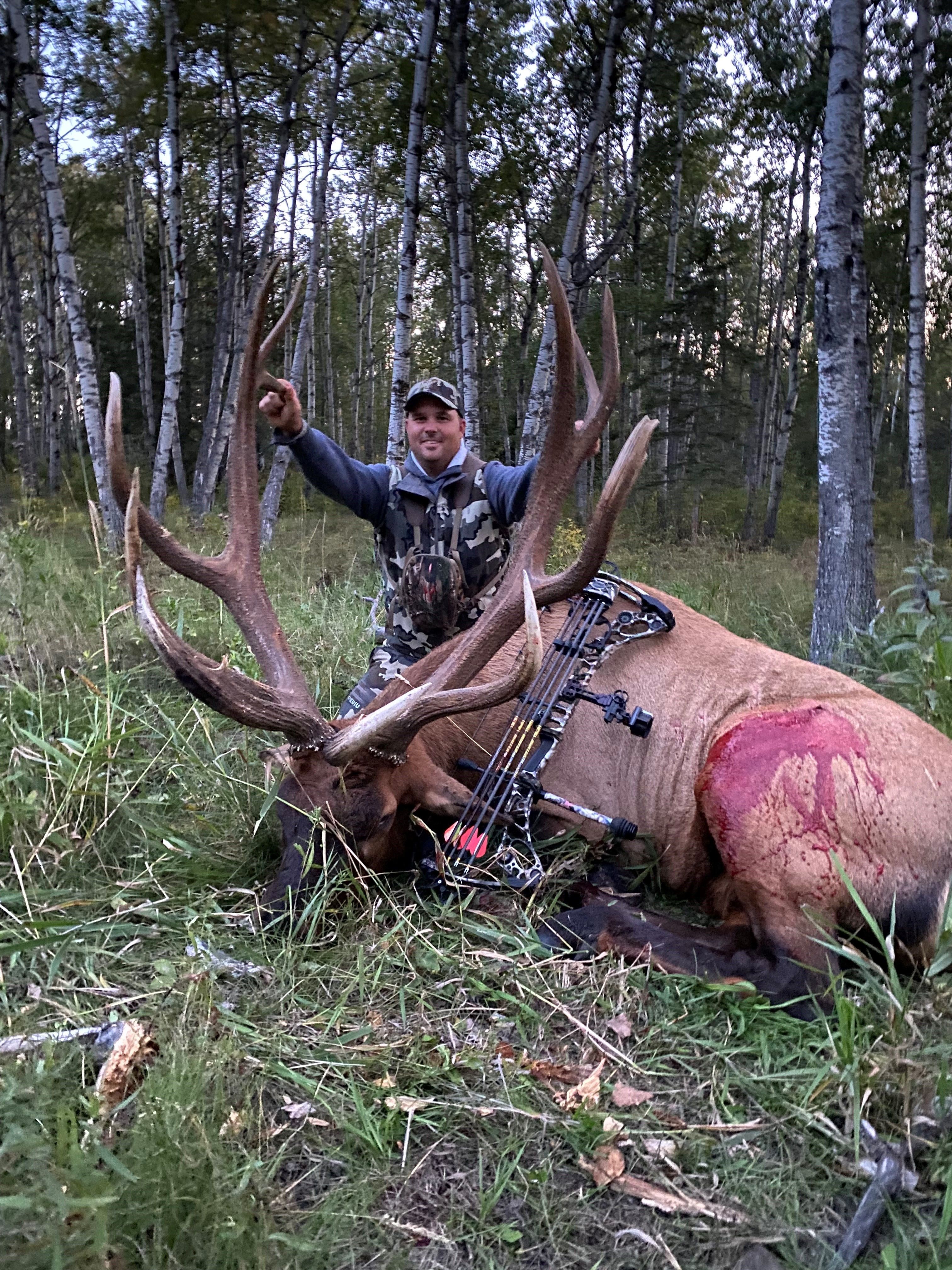 Issac Smith from North Dakota with trophy bull elk at Echo Lake Hunts in Saskatchewan