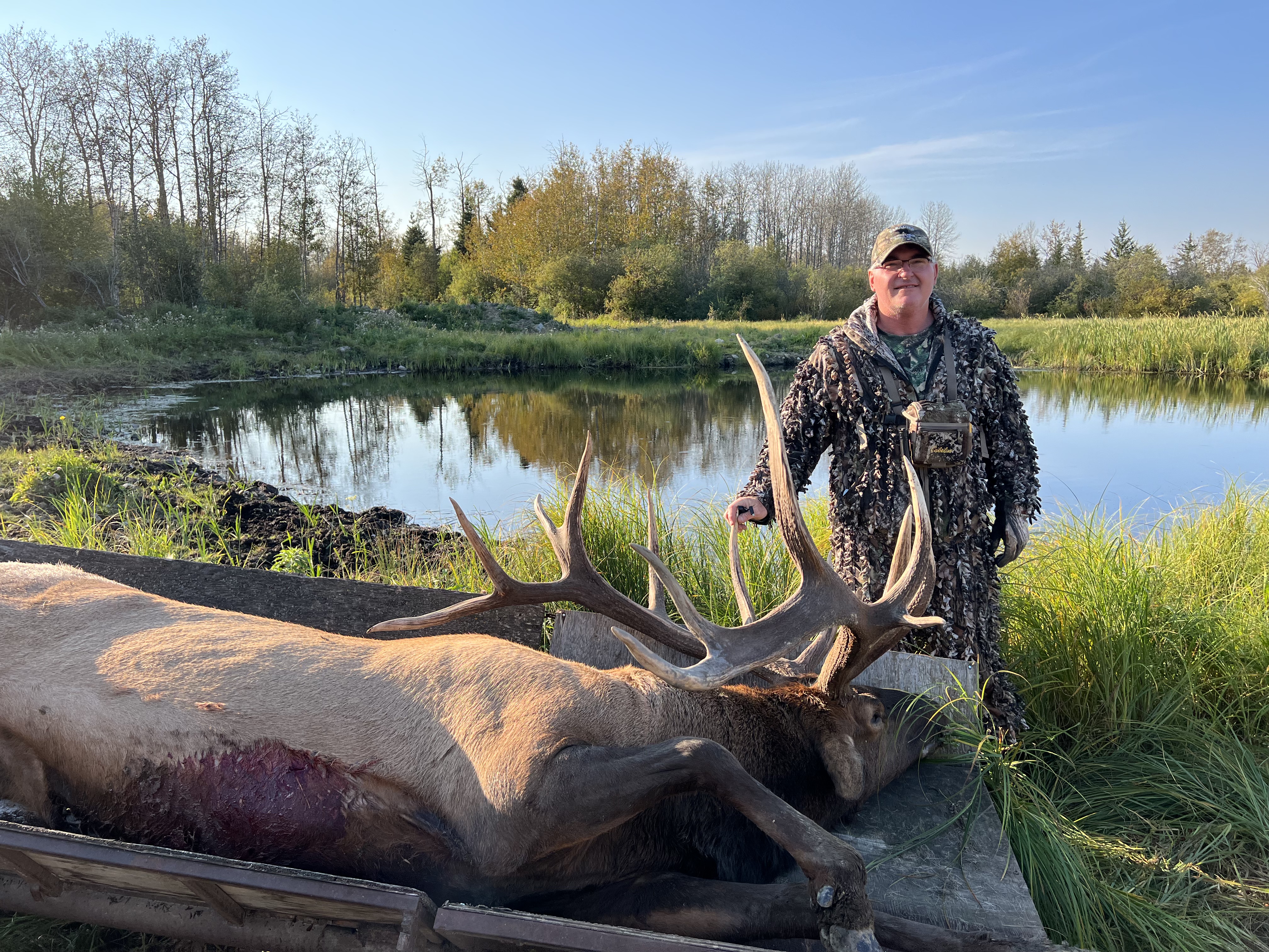 Barry Shrader from Texas with trophy bull elk at Echo Lake Hunts in Saskatchewan