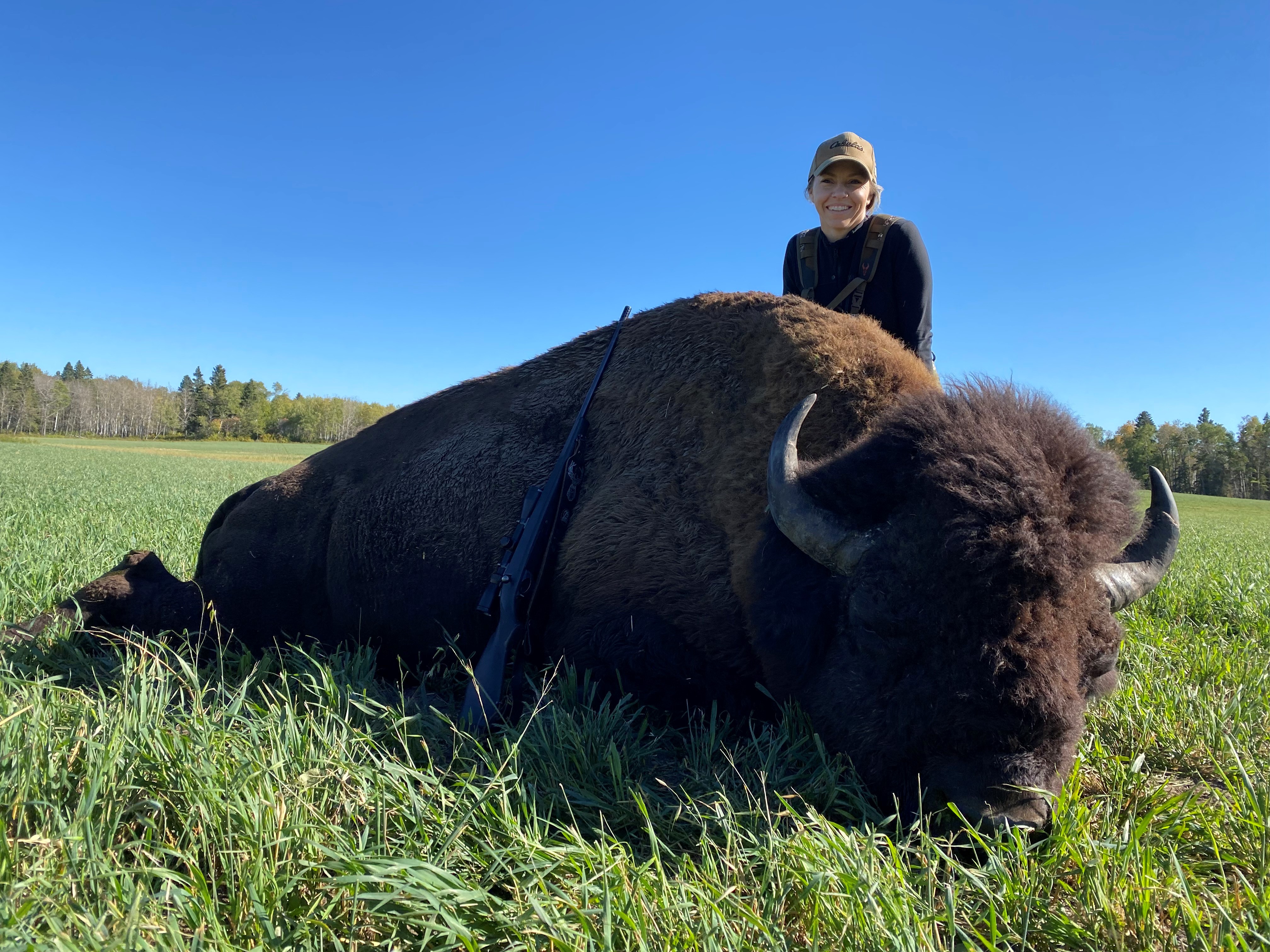 Danielle Campbell from California with trophy bison at Echo Lake Hunts in Saskatchewan