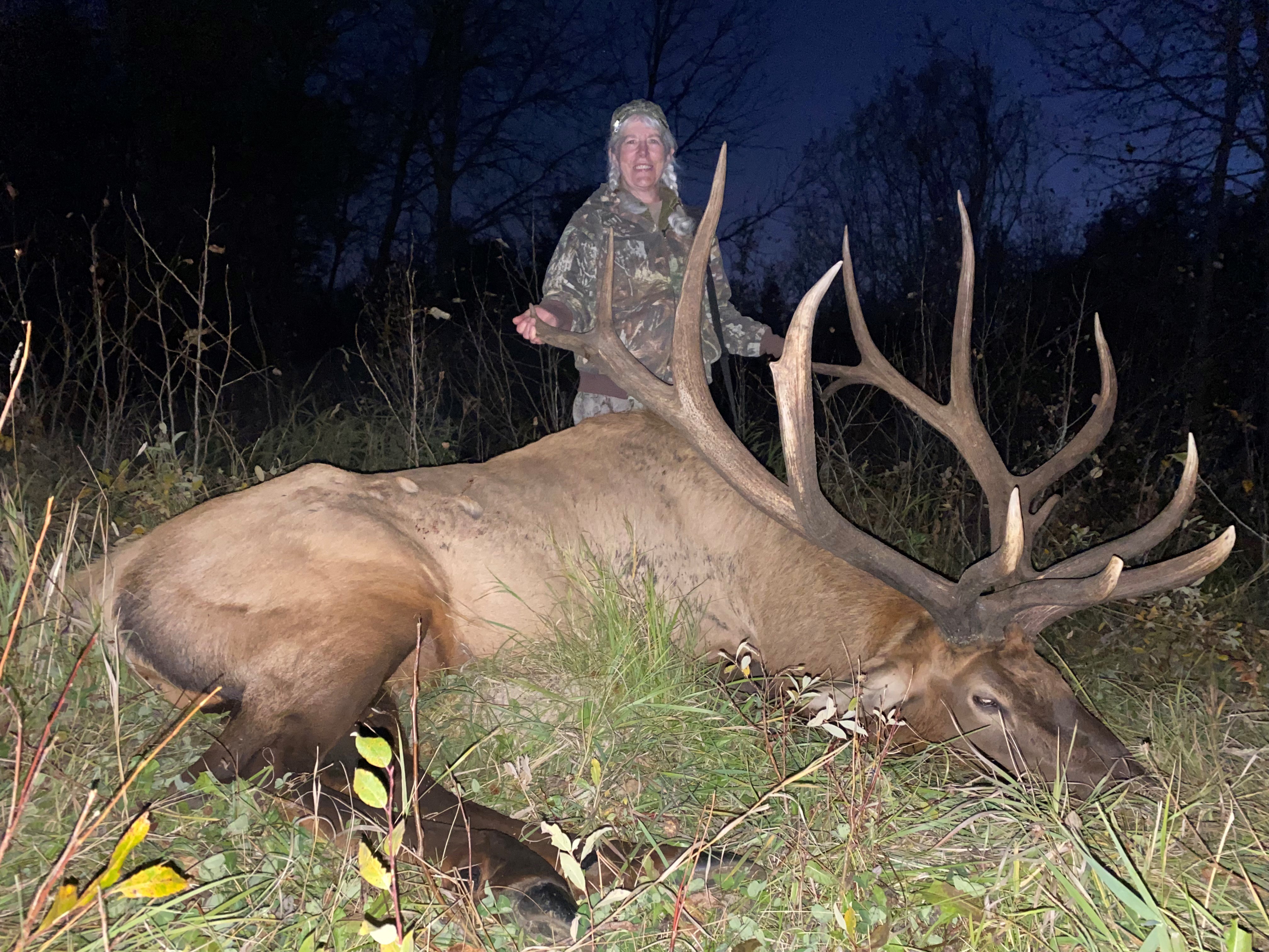 Rhonda from Montana with trophy bull elk at Echo Lake Hunts in Saskatchewan