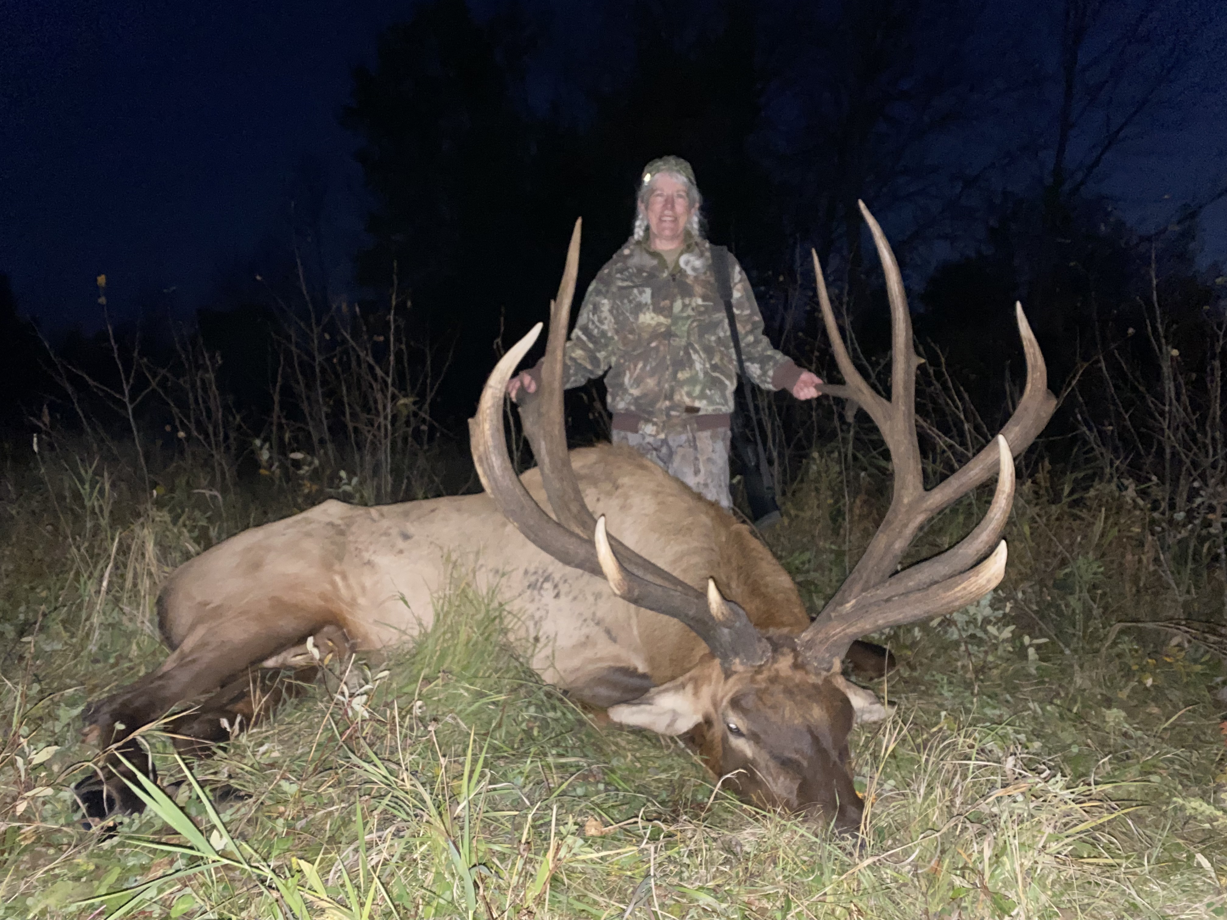 Rhonda from Montana with trophy bull elk at Echo Lake Hunts in Saskatchewan
