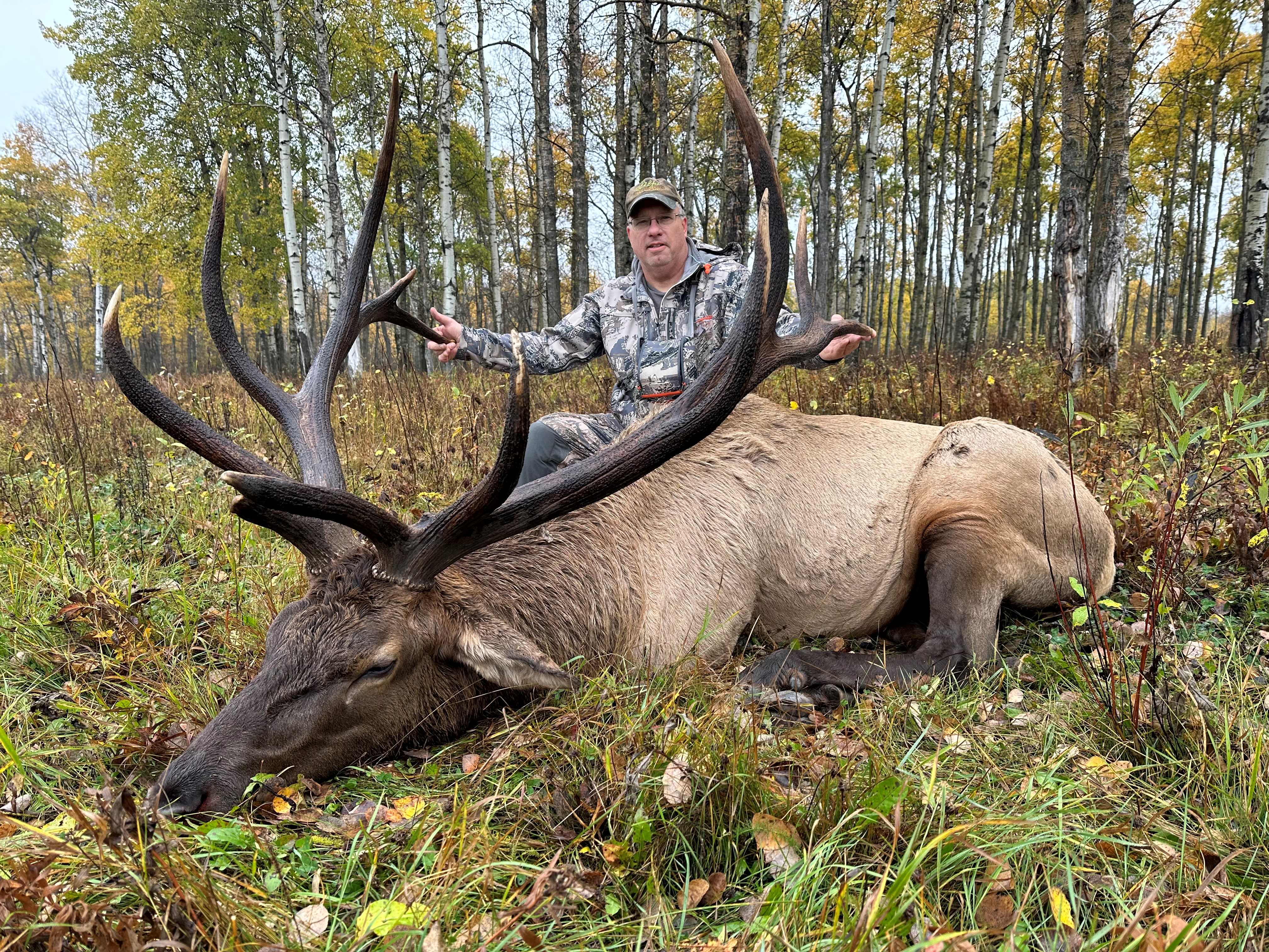 Bryce Orwick from Minnesota with trophy bull elk at Echo Lake Hunts in Saskatchewan