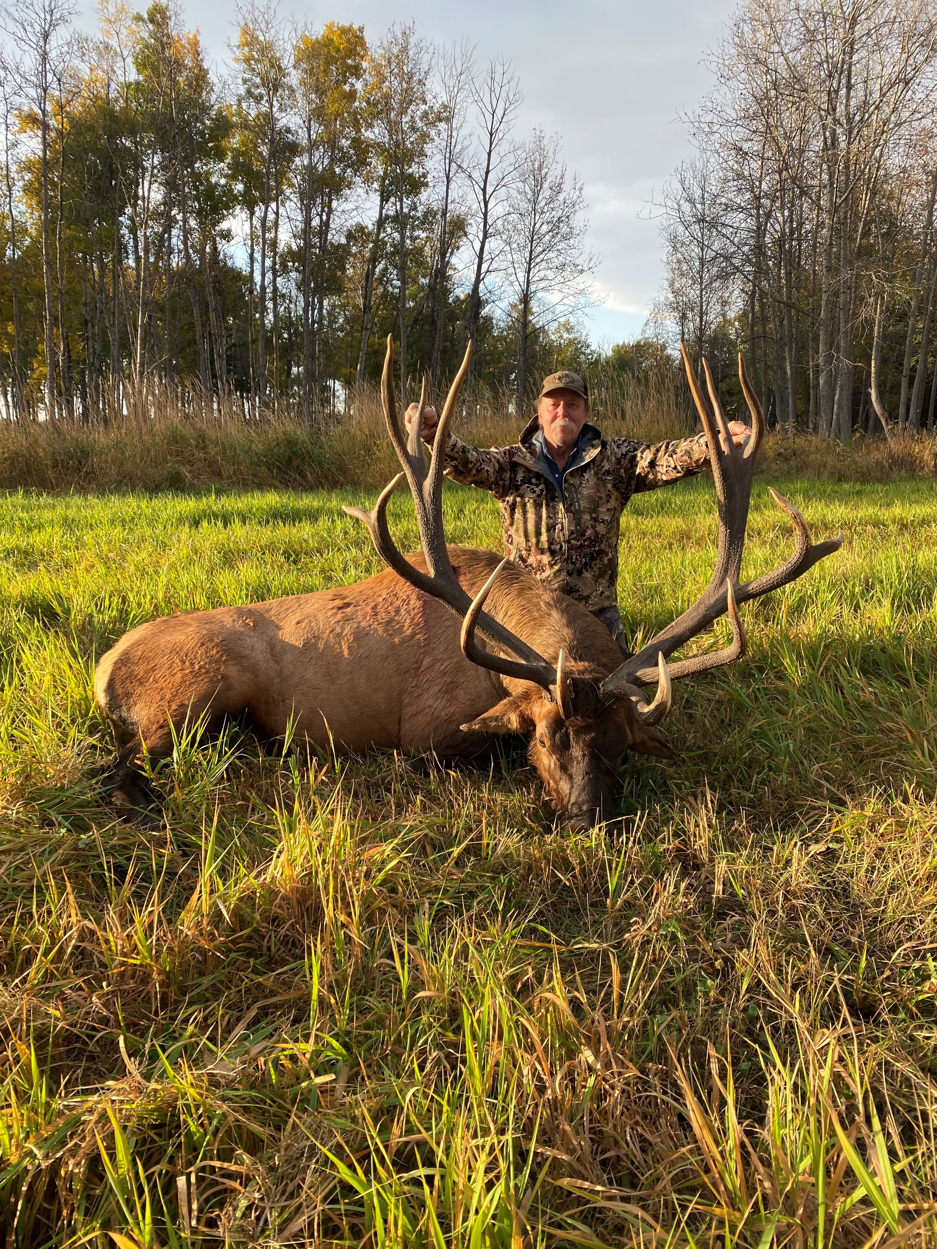 Harry Olson from Montana with trophy bull elk at Echo Lake Hunts in Saskatchewan