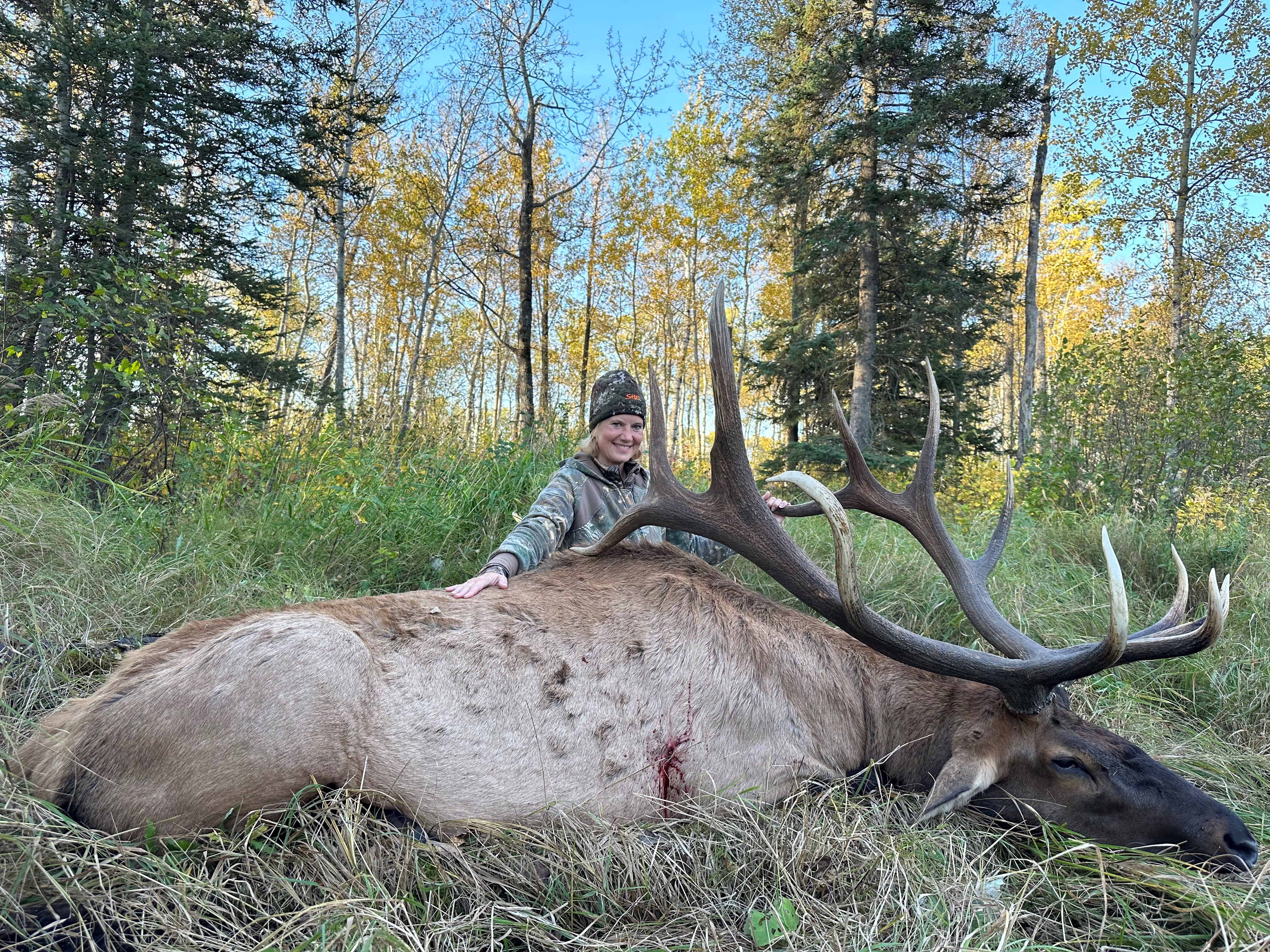 Amber Olson from Florida with trophy bull elk at Echo Lake Hunts in Saskatchewan