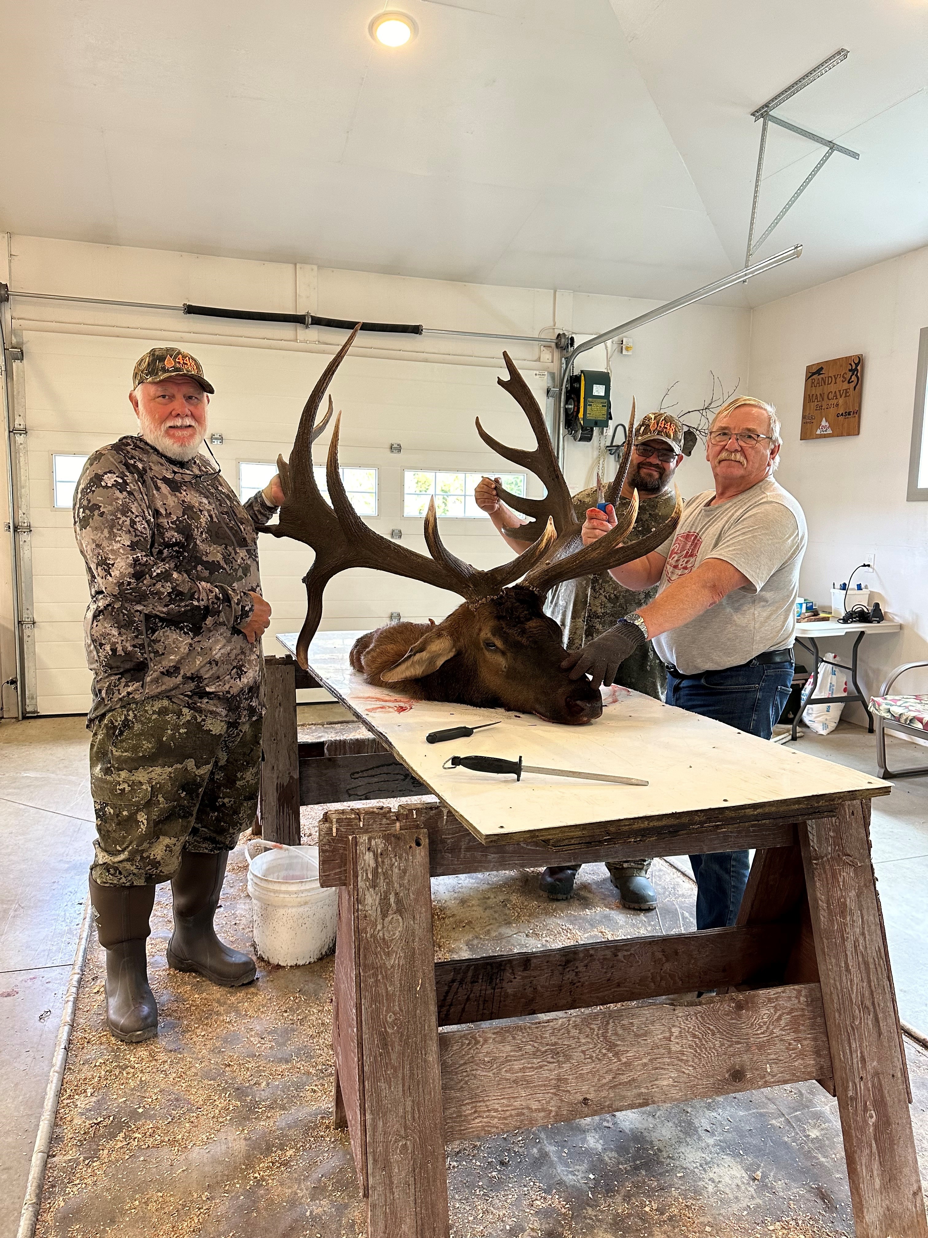 Tom caping an elk head after hunting elk in Saskatchewan Canada