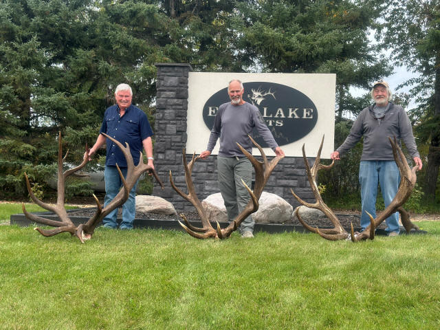 Pete, Jim and Charles with racks at the Echo Lake Hunts sign