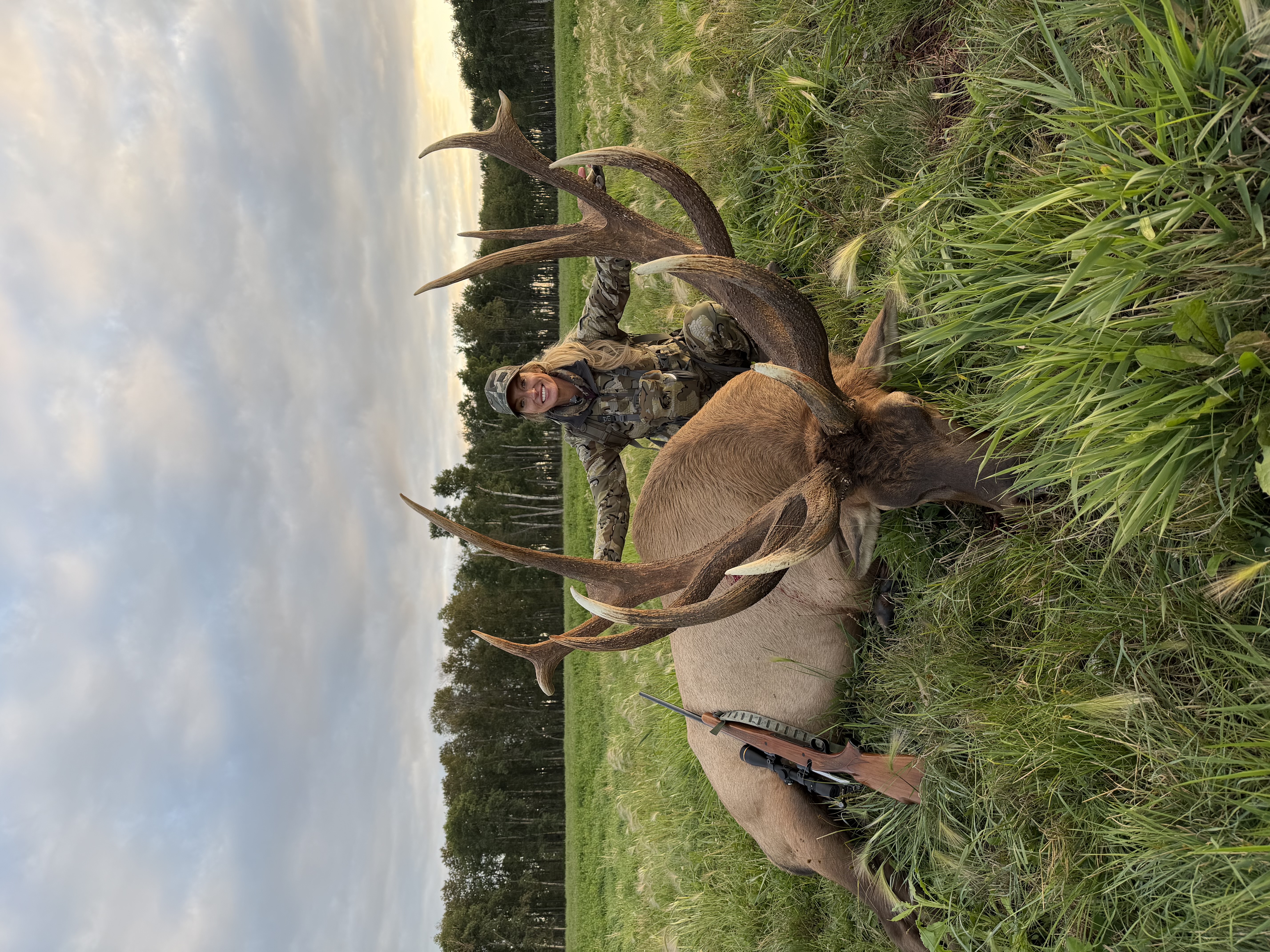 Rachelle Heller from Iowa with a trophy bull elk at Echo Lake Hunts in Saskatchewan