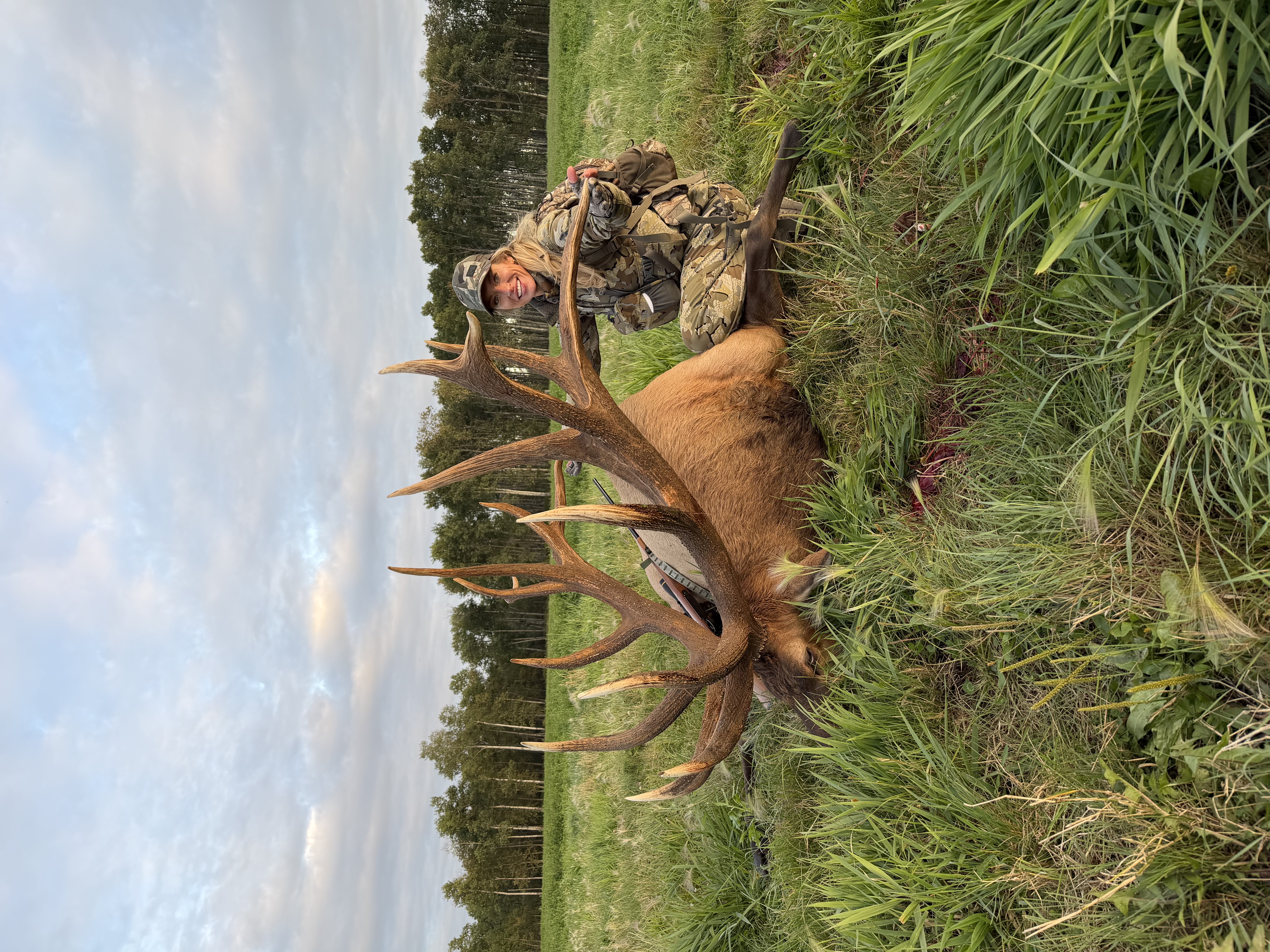 Rachelle Heller from Iowa with a trophy bull elk at Echo Lake Hunts in Saskatchewan