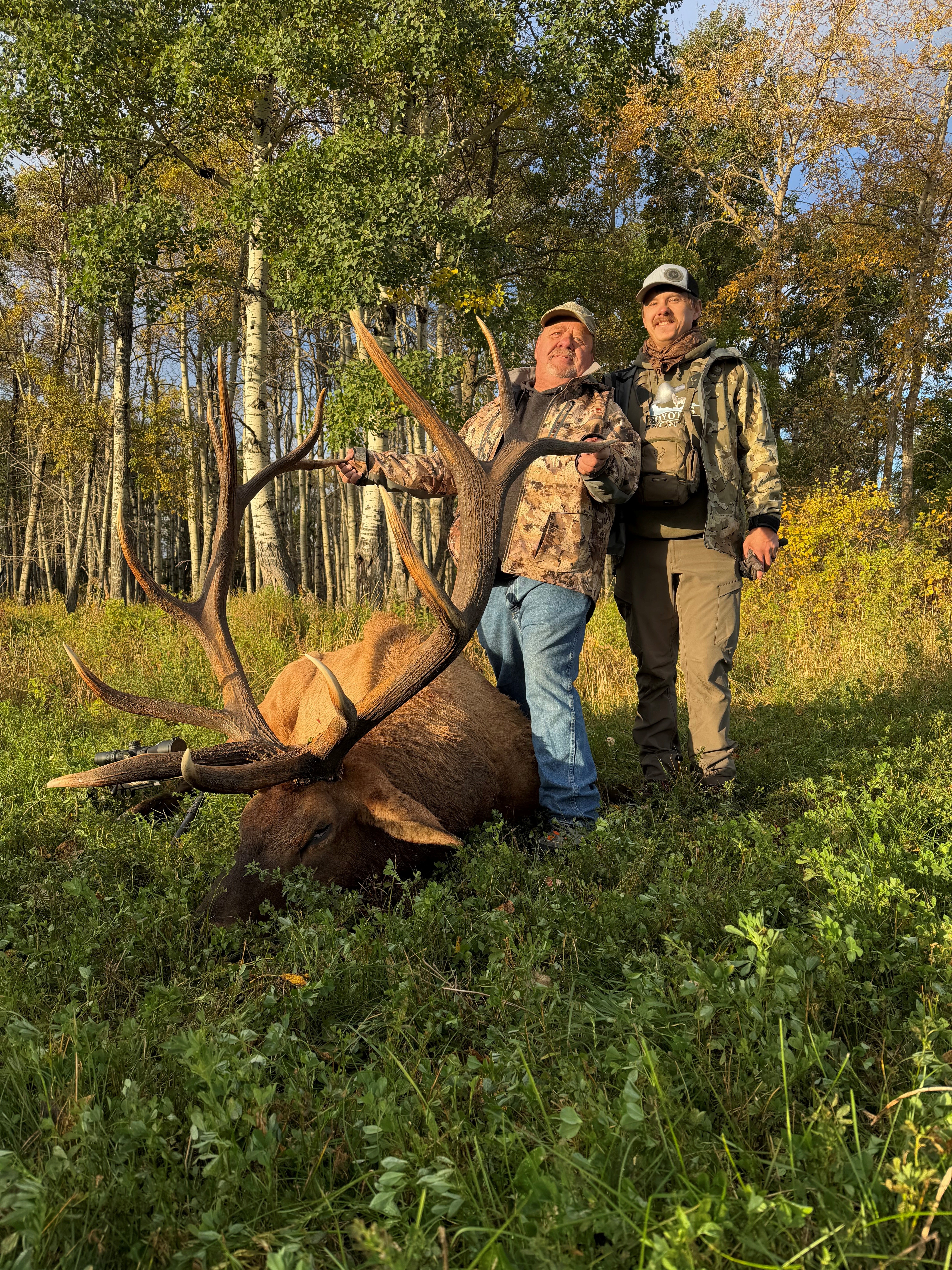 Joe & Jesse Gillespie from Montana with a trophy bull elk at Echo Lake Hunts in Saskatchewan