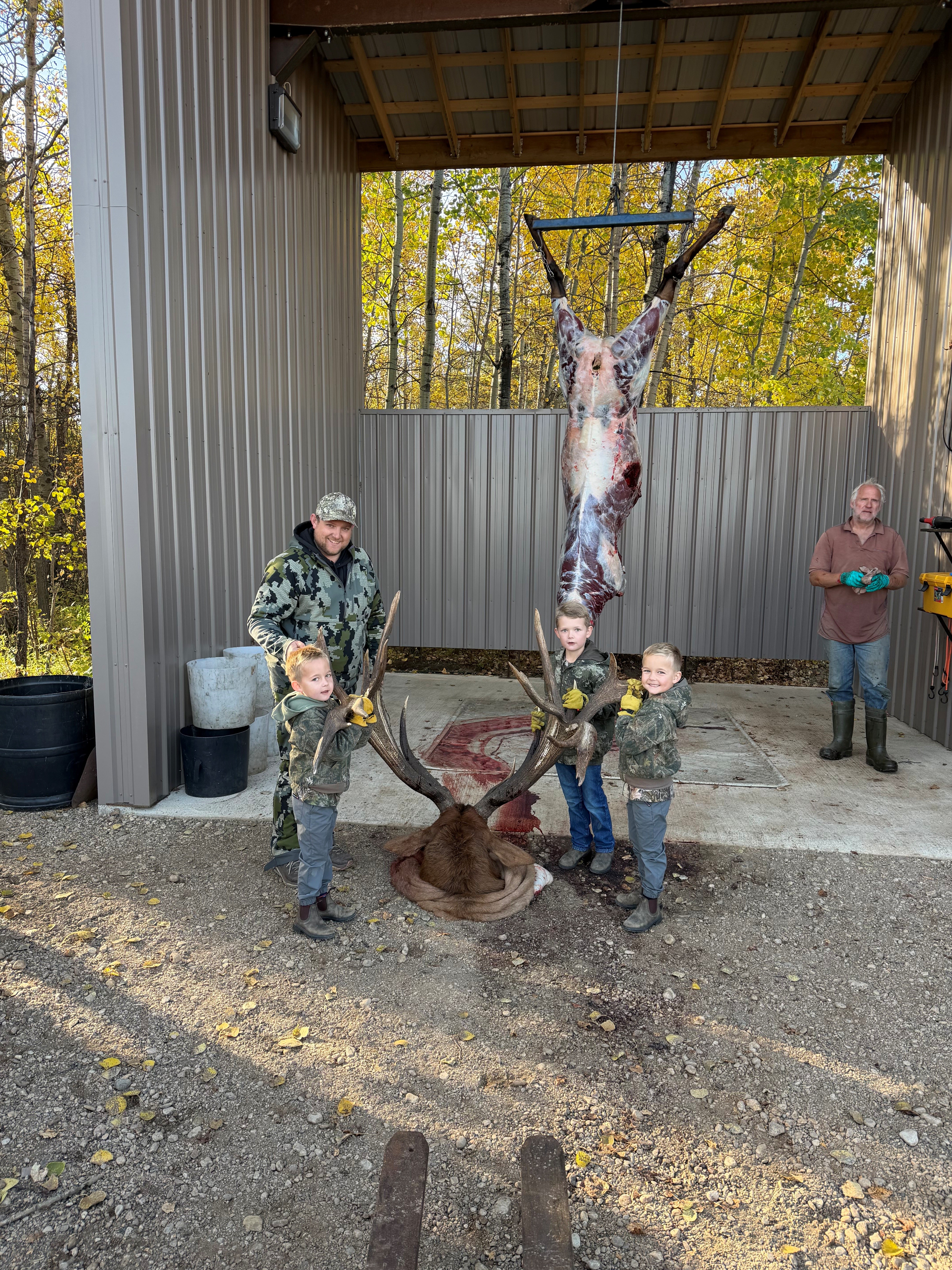 Randy's little helpers with a trophy bull elk at Echo Lake Hunts in Saskatchewan