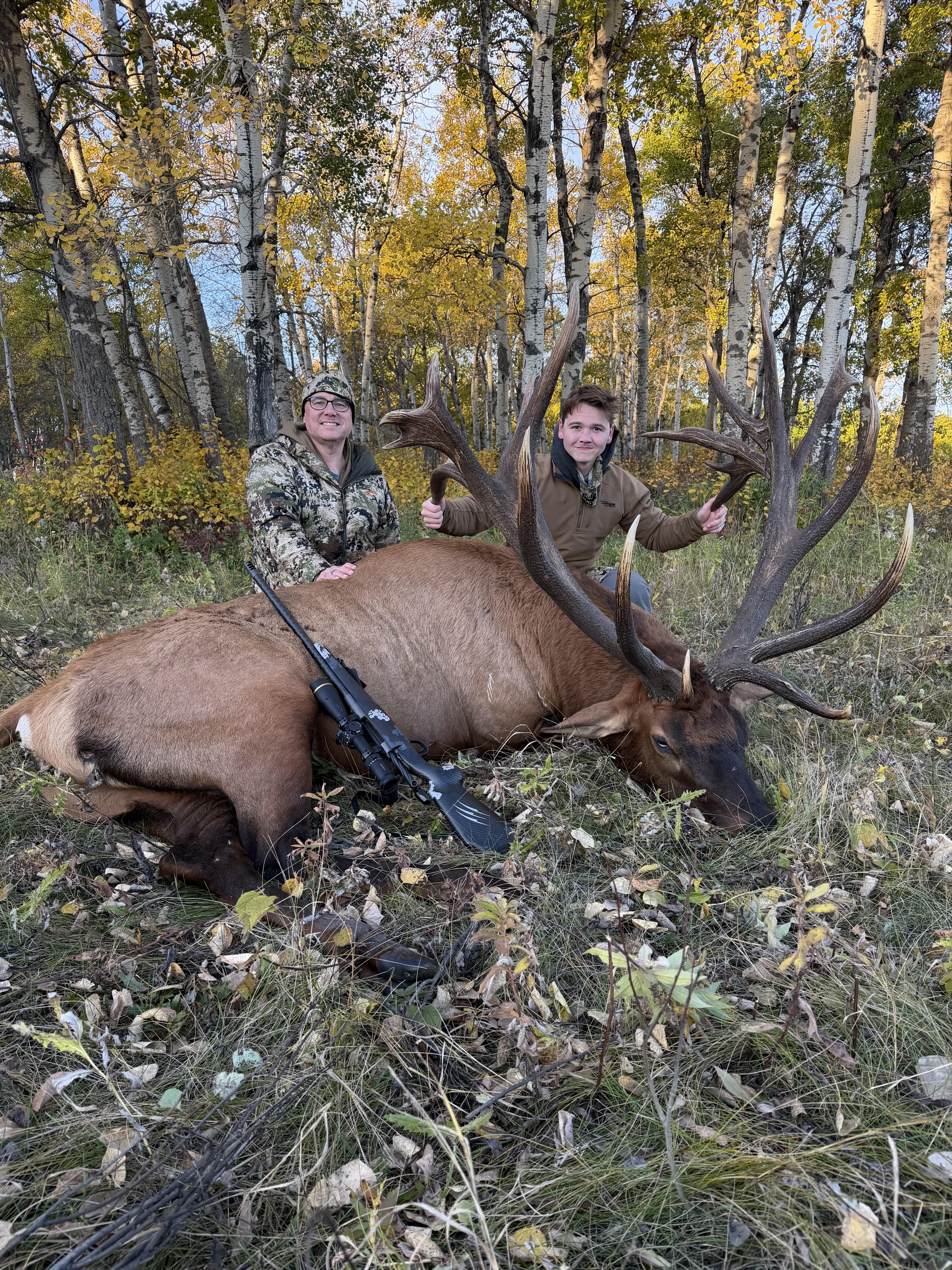 Scott and Grant Anderson from Florida with a trophy bull elk at Echo Lake Hunts in Saskatchewan